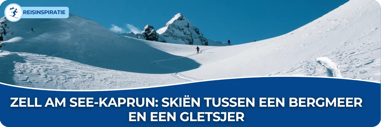 Man die de berg afgaat in Oostenrijk, met een helder blauwe lucht en een dikke pak sneeuw.