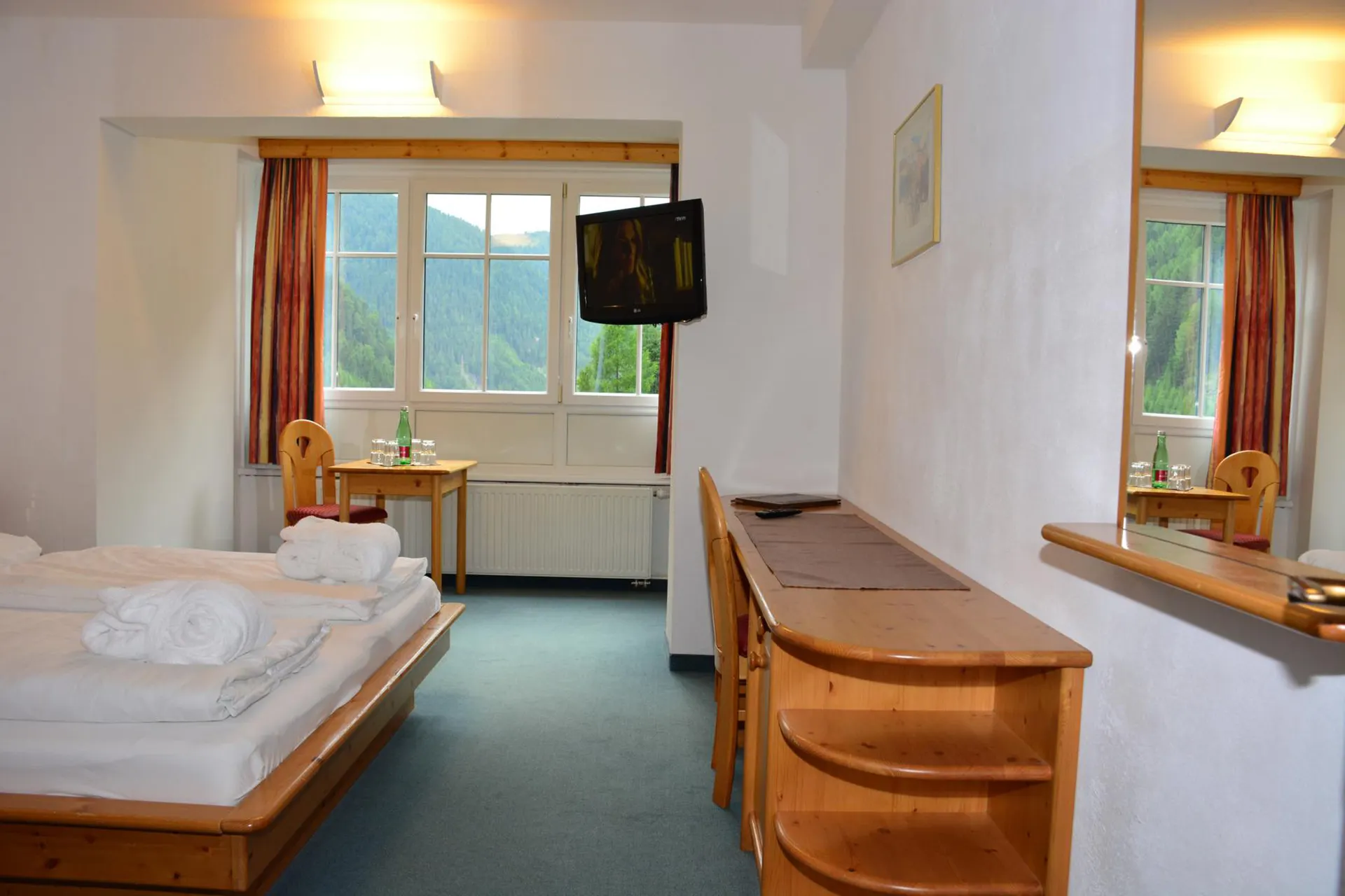 Kinder- und Familienhotel Nockalm - Tweepersoonskamer met 2 extra bedden